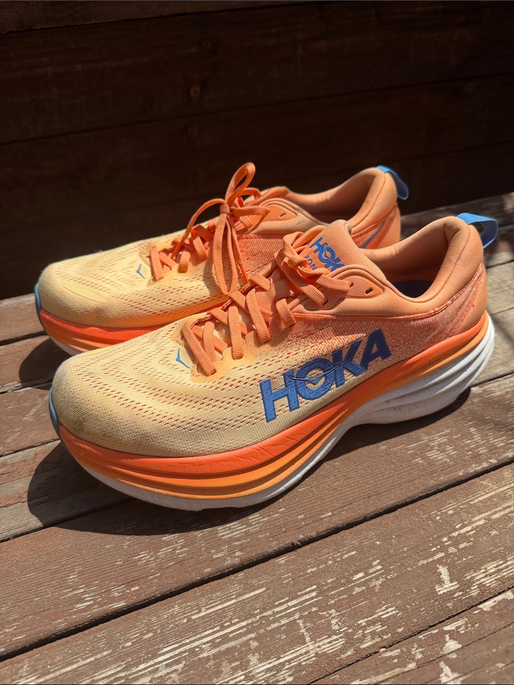 Hoka Kids Peach and Bright Orange Sneakers with Blue Logo